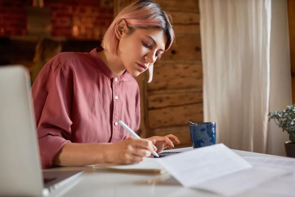 Student writing a scholarship essay
