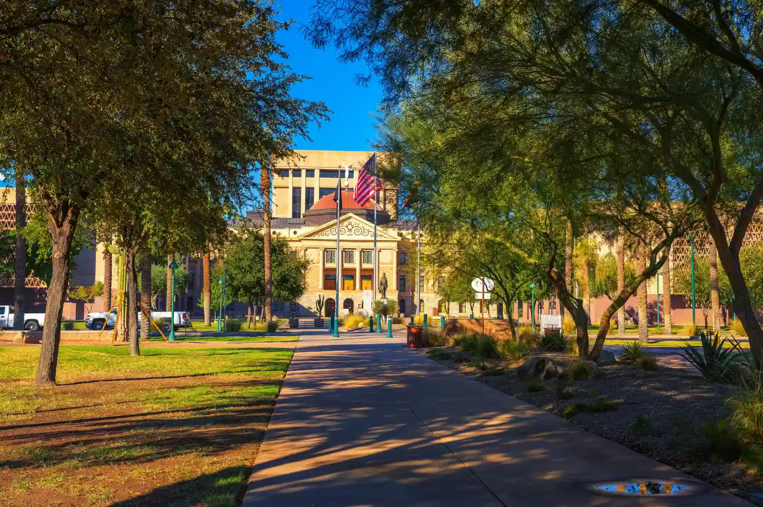 CalChannel: tree-lined walkway leading to a historic university building