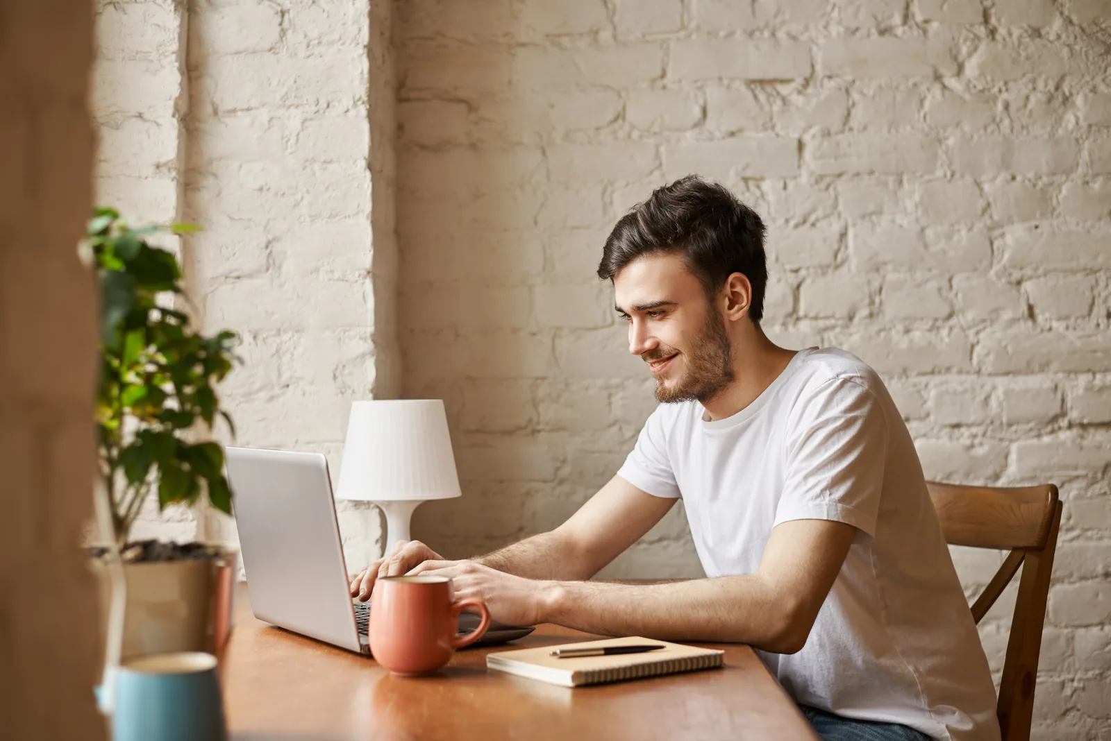 Student working on a college application on a laptop at home